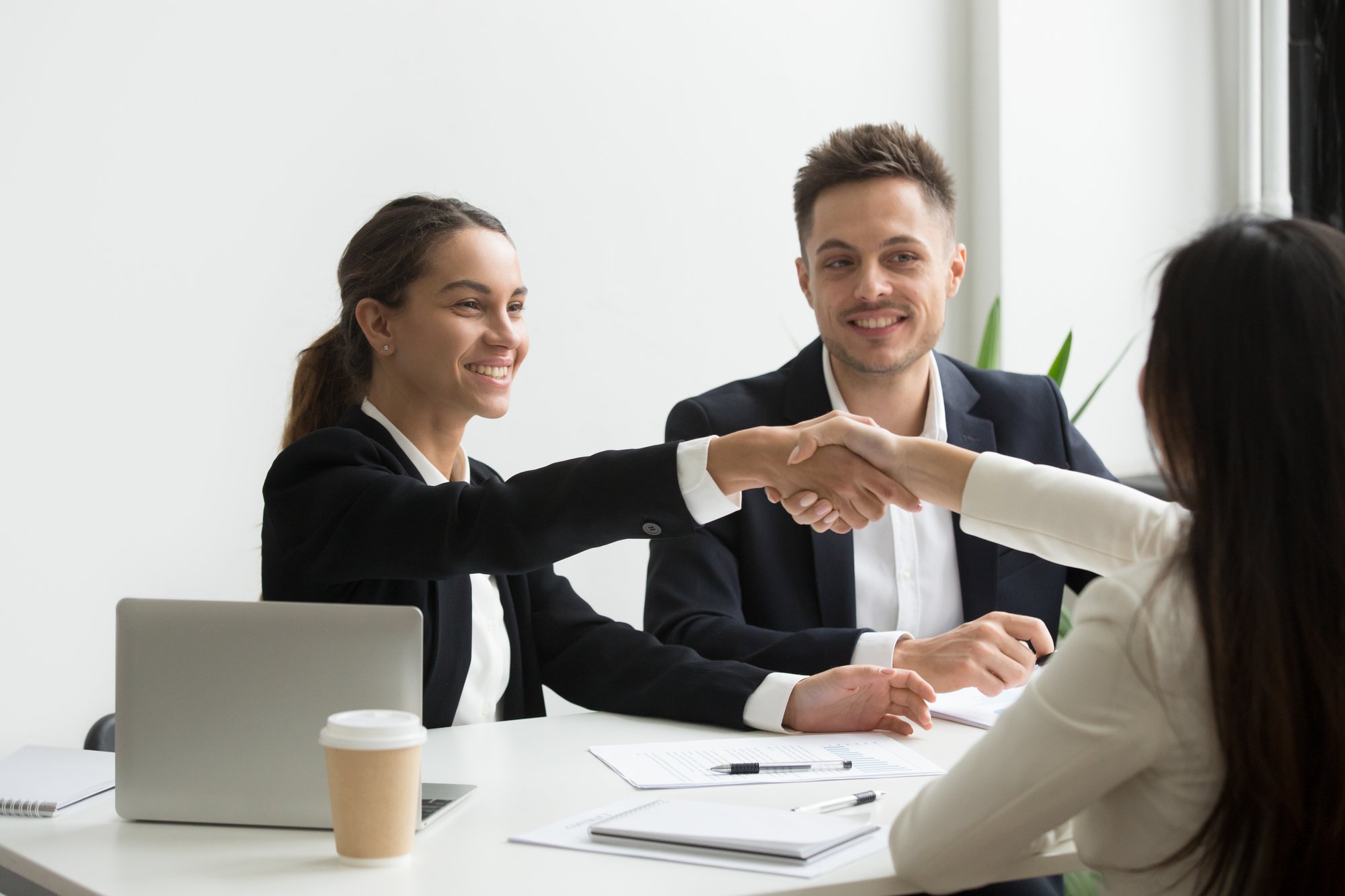 hr-representatives-positively-greeting-female-job-candidate-1 hr-representatives-positively-greeting-female-job-candidate-1